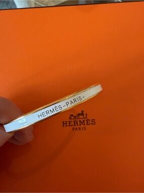 Hermès White and Gold Enamel Narrow Bangle Bracelet